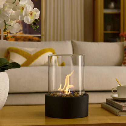 Belro portable glass tabletop fireplace for outdoor use, featuring a sleek design and clear glass enclosure.