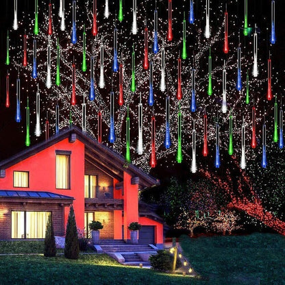 Belro LED Dripping Icicle Lights hanging outdoors, creating a festive, glowing winter display for home and garden decoration.
