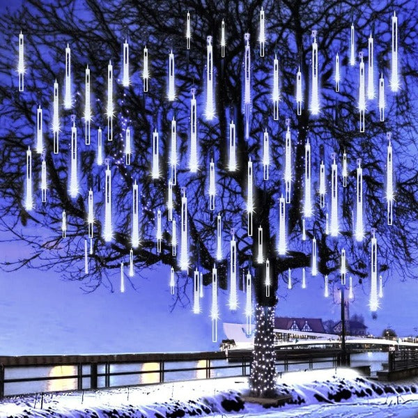 Belro LED dripping icicle lights hanging outdoors, illuminating with warm white glow for home and garden decor.