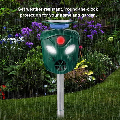 Belro 360° Solar Ultrasonic Animal Repeller in outdoor garden setting, showing device with solar panel and infrared sensors.
