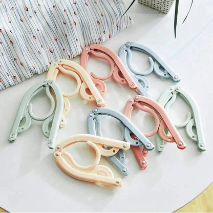 Belro foldable travel clothes hanger with multiple hooks, compact and lightweight for easy packing and organization.