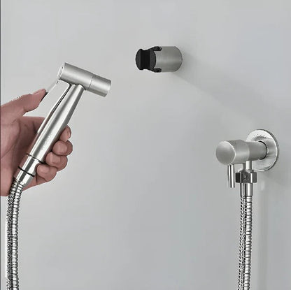 Belro handheld bidet sprayer attached to a bathroom sink, featuring a chrome finish and ergonomic handle for easy cleaning.