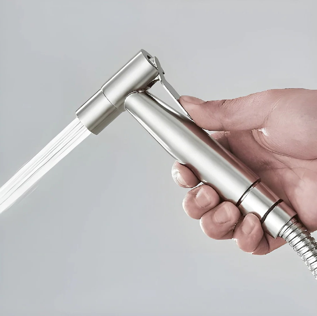 Belro handheld bidet sprayer attached to bathroom sink with flexible hose, versatile tools and hardware for personal hygiene.