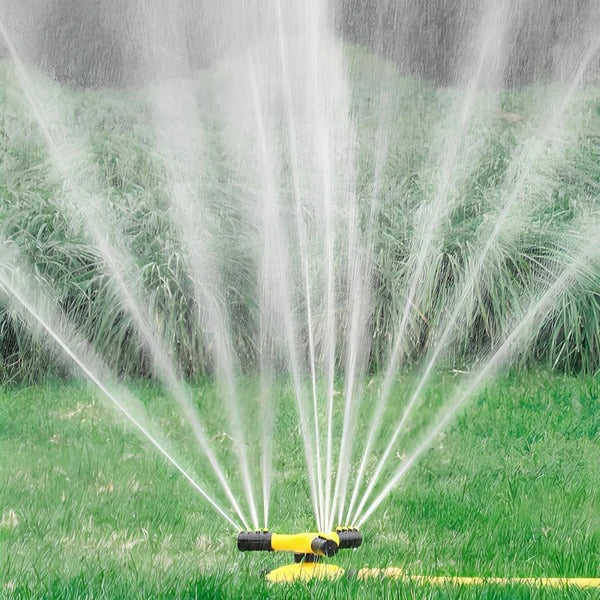 Belro 360 rotating lawn sprinkler in action, watering a garden with even coverage for outdoor home and garden use.