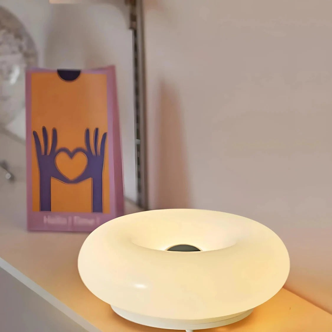 Belro Donut LED touch lamp providing soft, colorful lighting for a cozy night light or decorative accent in a modern home.