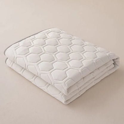 Belro cooling mattress pad on a bed, designed to enhance sleep comfort with breathable, cooling fabric for hot nights.