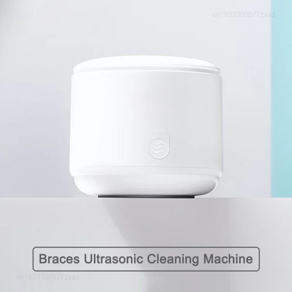 Belro compact ultrasonic jewelry cleaning device with a small stainless steel basin and control buttons for effective cleaning.