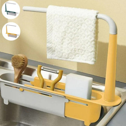 Belro expandable sink organizer in a kitchen, showing multiple compartments for dish soap, sponges, and cleaning supplies.