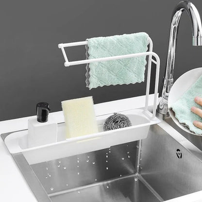 Belro expandable sink organizer for kitchen, with multiple compartments for utensils and sponges, fitting various sink sizes.