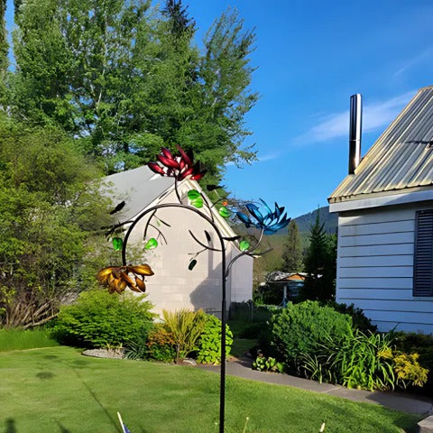Colorful summer flower wind spinner by Belro, vibrant garden decor featuring spinning metal flowers in a bright outdoor setting.
