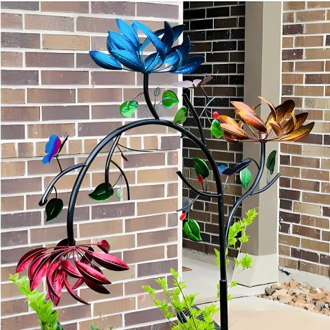 Colorful summer flower wind spinner by Belro, featuring vibrant petals spinning in a garden breeze.