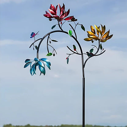 Colorful summer flower wind spinner by Belro, vibrant outdoor garden decor with spinning floral design on a metal stake.