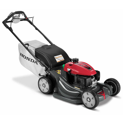 Honda HRX217VKA 21-inch gas self-propelled lawn mower with a 200cc engine, shown in a garden setting.