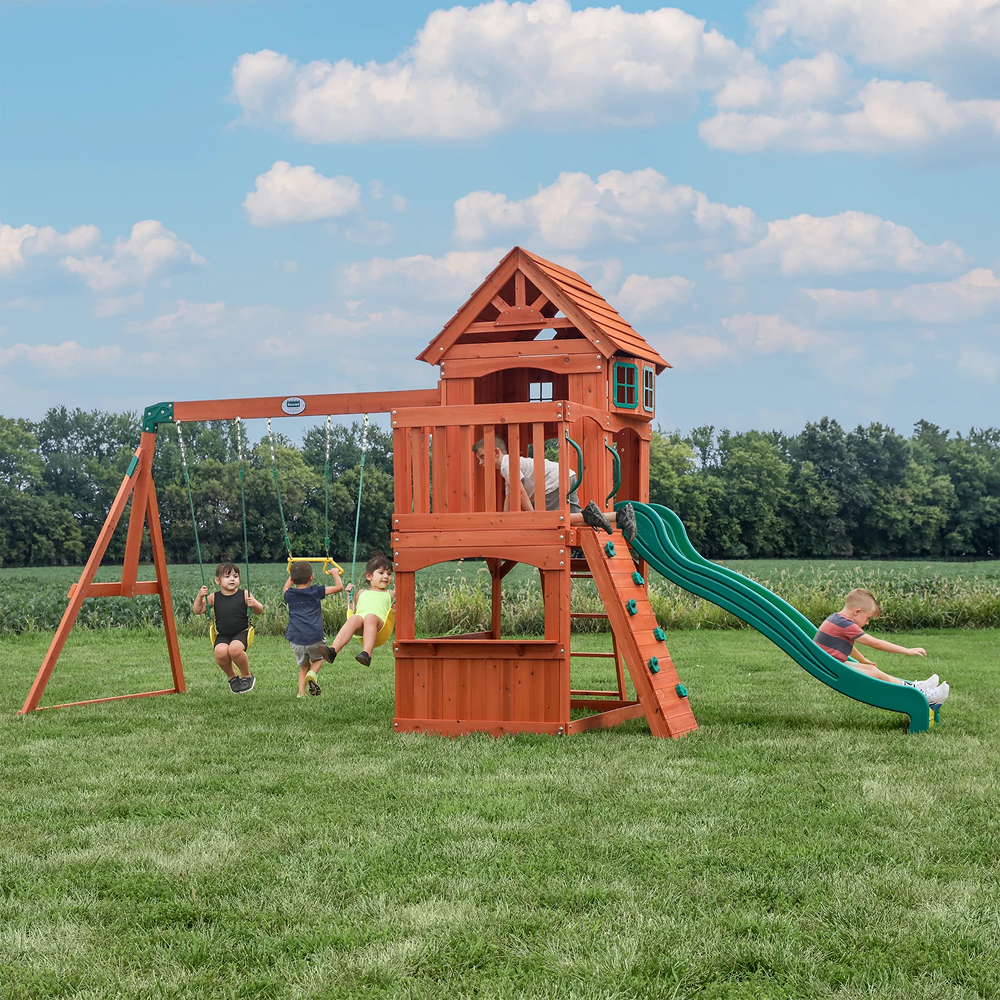 Casavibeo Atlantis wooden swing set with slide and play deck, featuring a sturdy frame and colorful accessories for outdoor fun