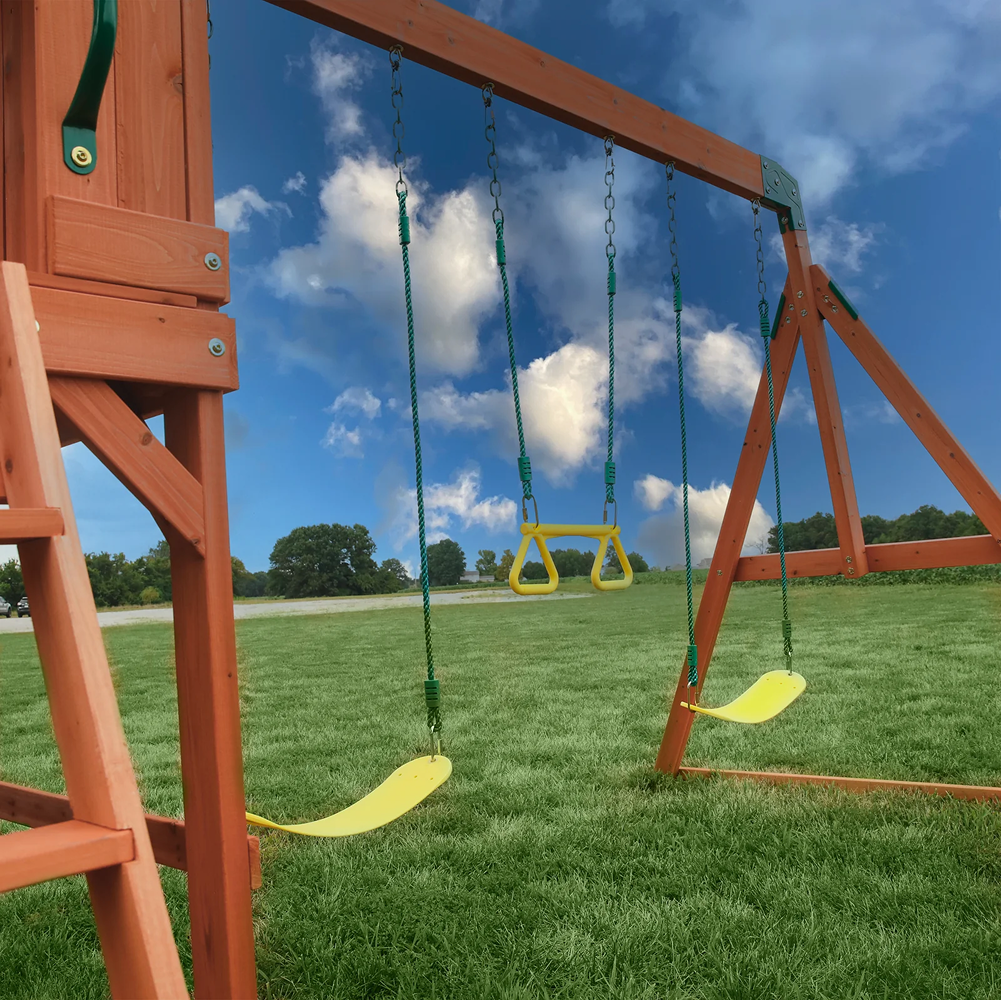 Casavibeo Atlantis wooden swing set with slide and play deck, featuring sturdy construction and colorful accessories for kids' outdoor play