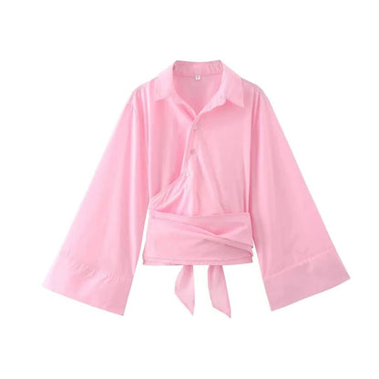Men's Belro blouse with wide bow belt, stylish clothing featuring a relaxed fit and a prominent bow detail at the waist.