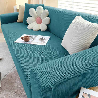 Stretchable Belro sofa cover fitting a standard sofa, made of soft, durable fabric, designed to protect and refresh your living room furniture.
