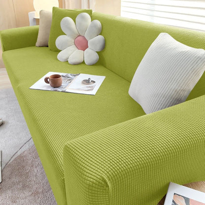 Stretchable Belro sofa cover in a living room setting, showcasing its fit and fabric texture on a modern sofa.