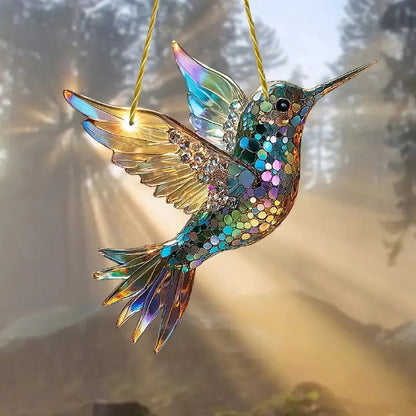 Colorful hummingbird suncatcher hanging in a window, decorative glass decor for home and garden by Belro.
