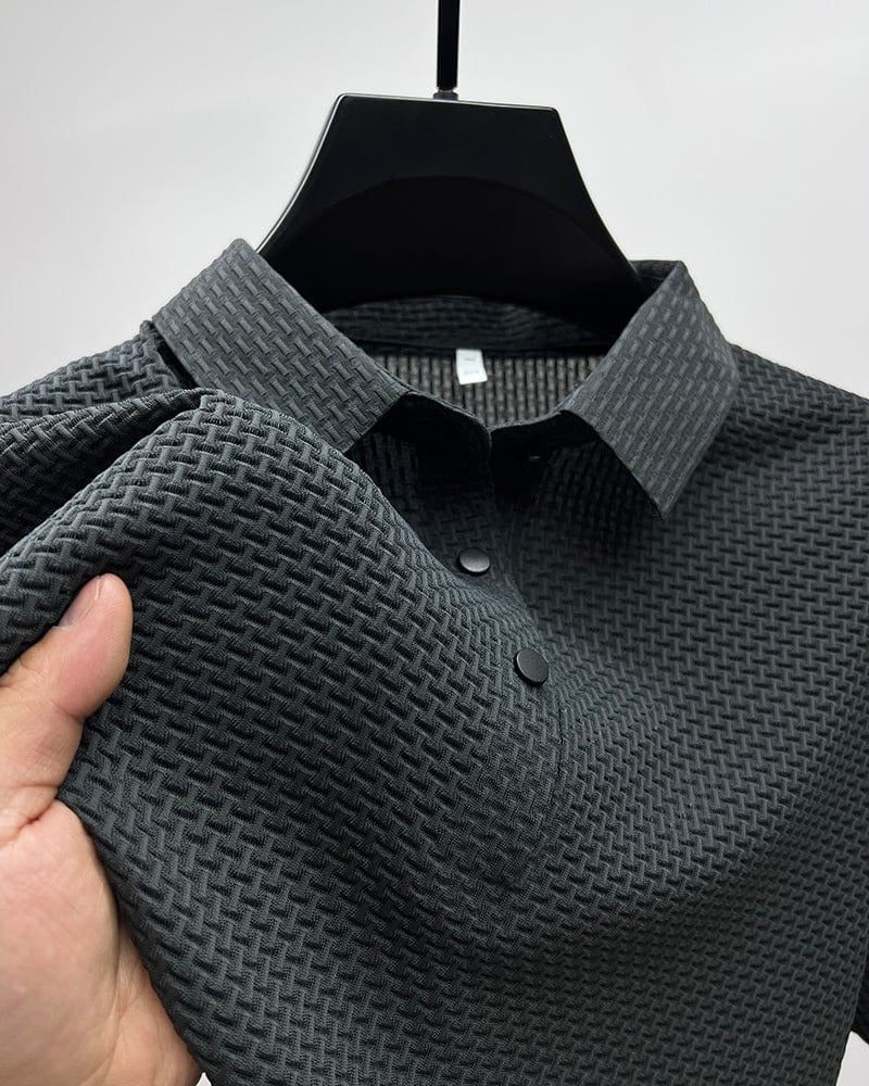 Men's Belro mesh polo shirt in navy blue, featuring breathable fabric, collar, and short sleeves, suitable for casual wear.