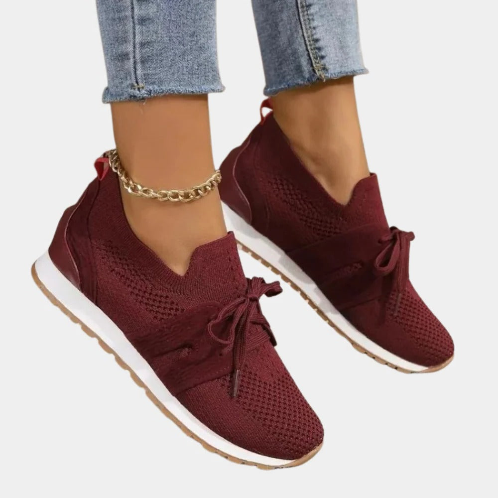 Belro stylish women's sneakers in white with pink accents, athletic footwear with breathable mesh upper and cushioned sole.