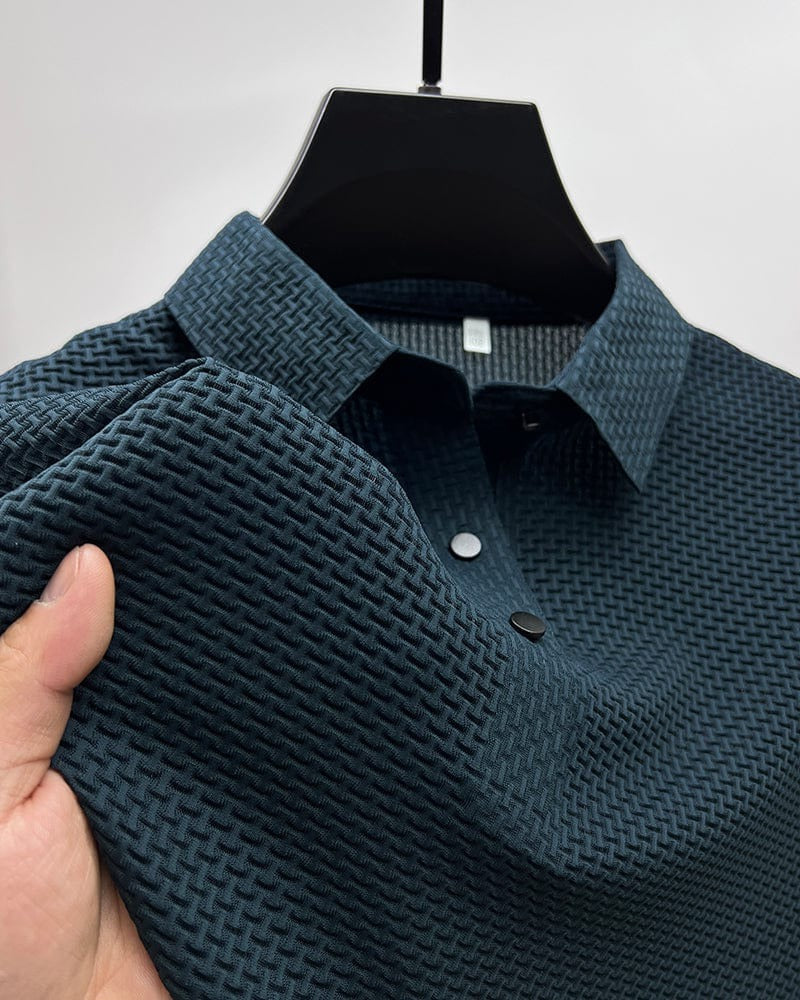 Men's Belro mesh polo shirt in navy, showing lightweight fabric, short sleeves, and classic collar on a model.