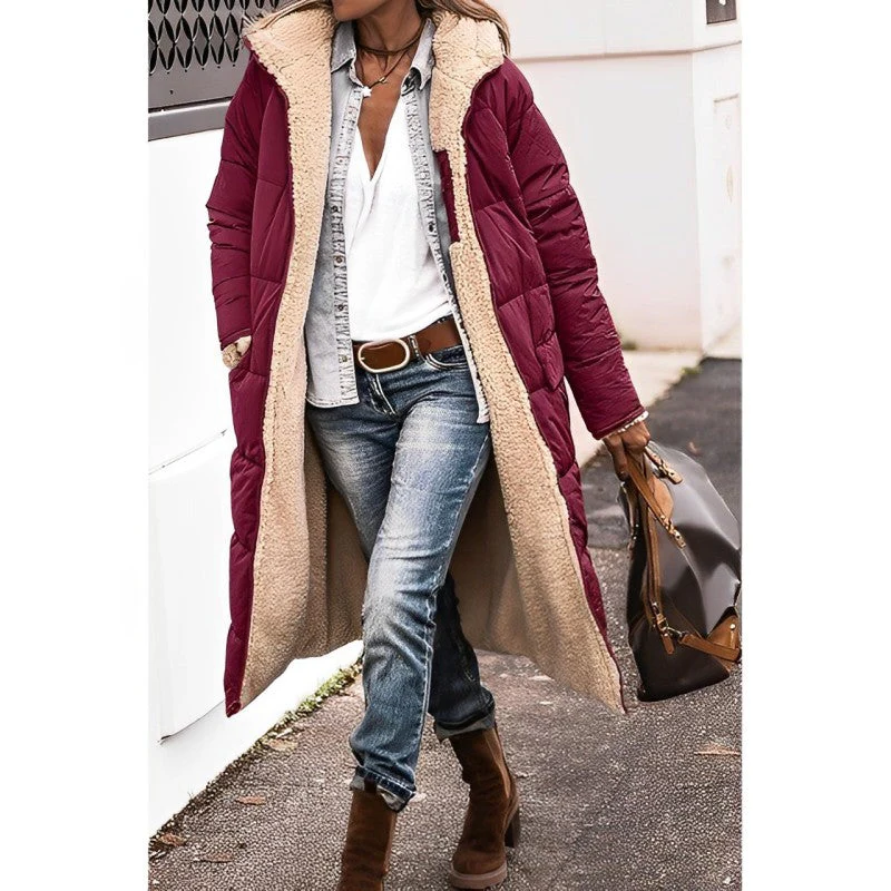Belro women's long comfortable coat with a relaxed fit, perfect for chilly weather, shown hanging on a neutral background.
