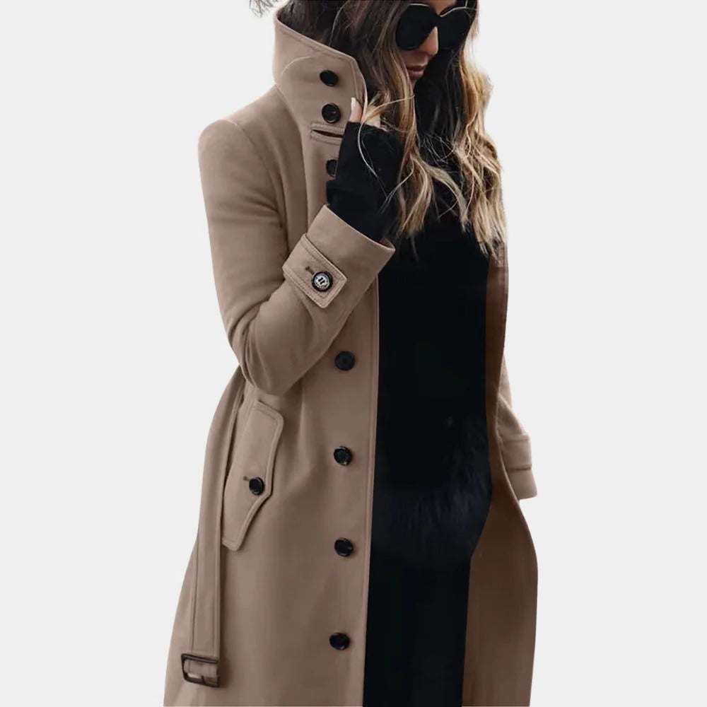 Belro women's trenchcoat hanging on a clothing rack, featuring classic design and neutral color, perfect for stylish outerwear.