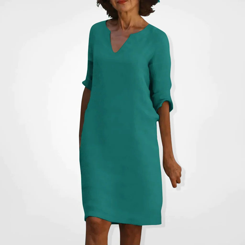 Belro summer dress with V-neck, lightweight and stylish, featuring a flowy design perfect for warm weather.