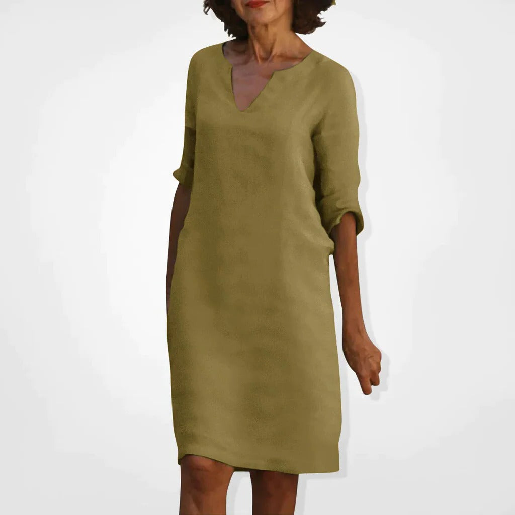 Belro summer dress with V-neck, lightweight fabric, and sleeveless design perfect for warm weather, shown in a natural pose.