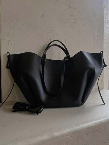 Vintage women's tote bag by Belro, spacious shoulder bag with classic design, displayed with handles and interior view.