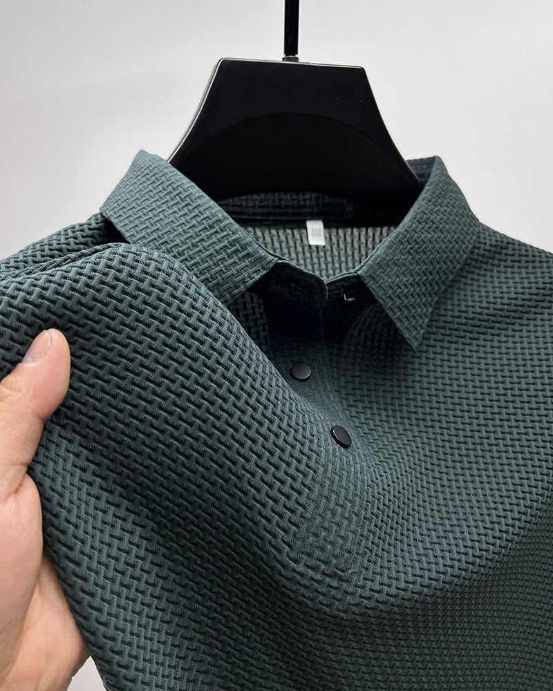 Men's Belro mesh polo shirt in blue, showing a close-up of the breathable fabric and classic collar design.