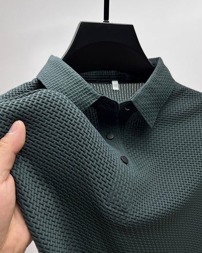Men's Belro mesh polo shirt in blue, showing a close-up of the breathable fabric and classic collar design.