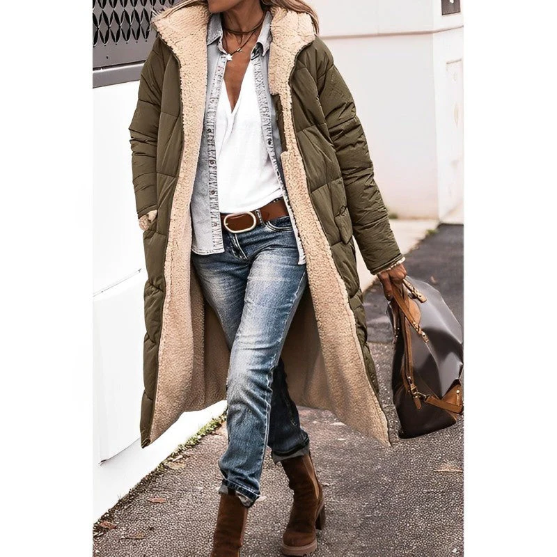 Long comfortable women's coat by Belro, shown hanging with a relaxed fit and cozy fabric in a neutral color.