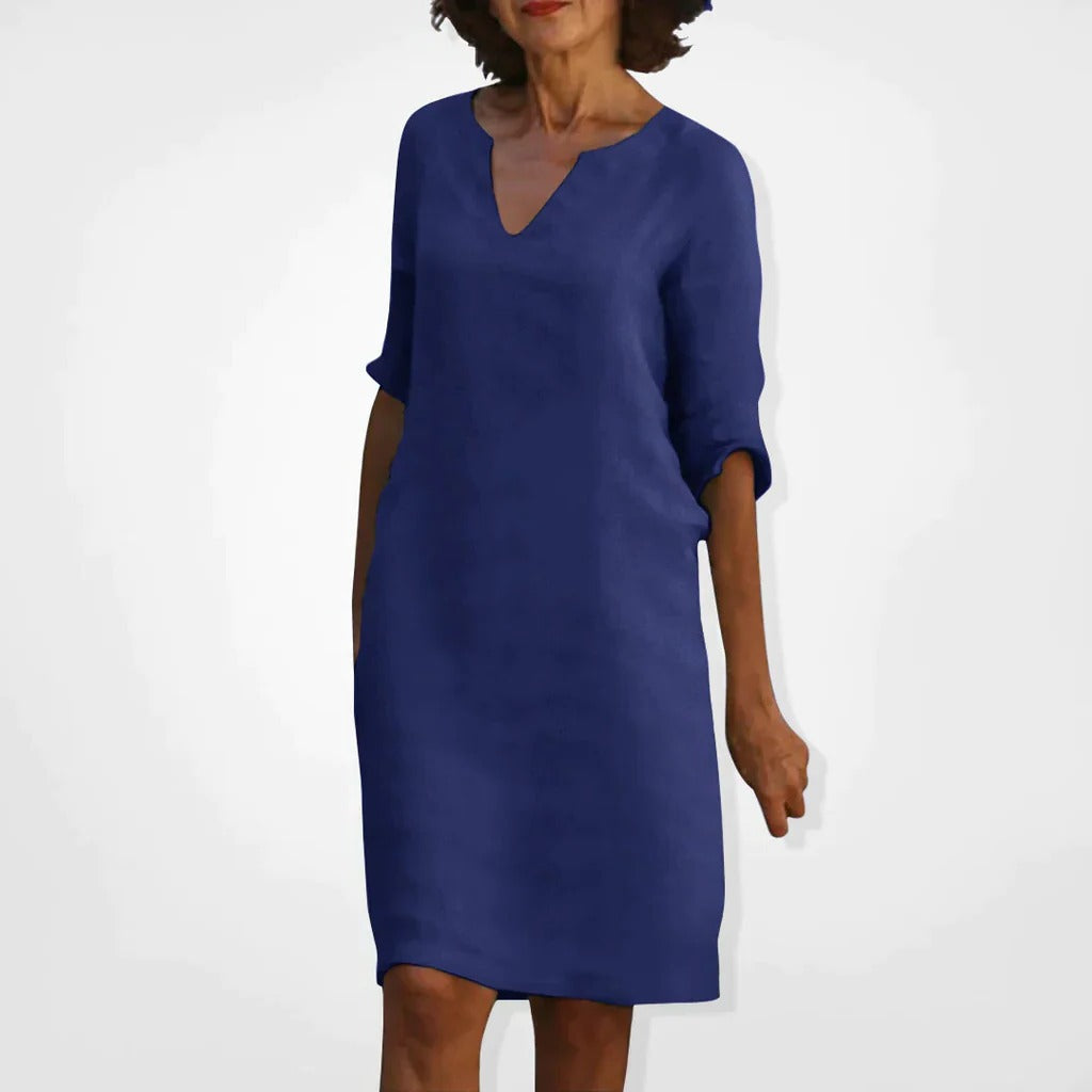 Belro summer dress with V-neck, sleeveless design, lightweight fabric, and floral pattern perfect for warm weather.