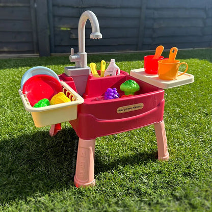 Children’s play kitchen with flowing water feature, colorful plastic design, and realistic kitchen accessories for imaginative play.