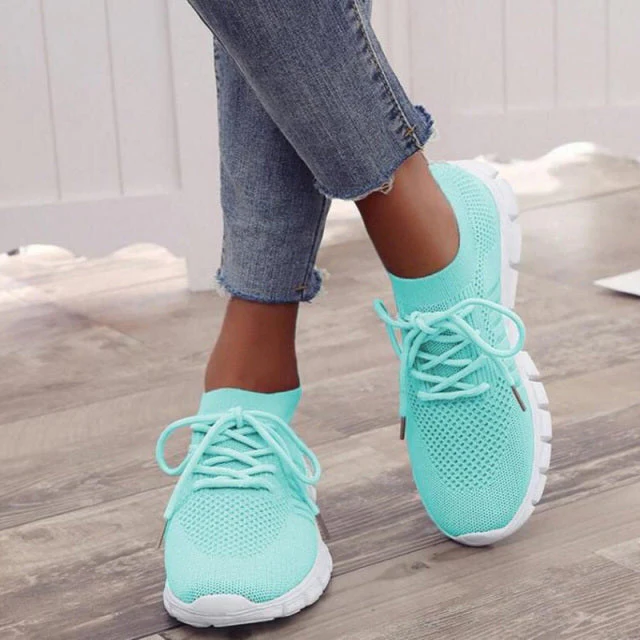 Belro orthopedic sneakers in gray with white soles, featuring supportive design and breathable fabric for comfortable foot support.