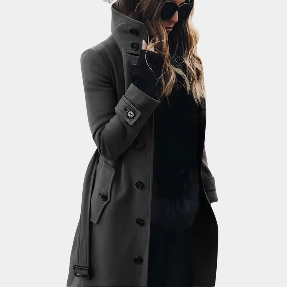 Belro women's trenchcoat, stylish and tailored, shown hanging on a wooden hanger with a classic double-breasted design.