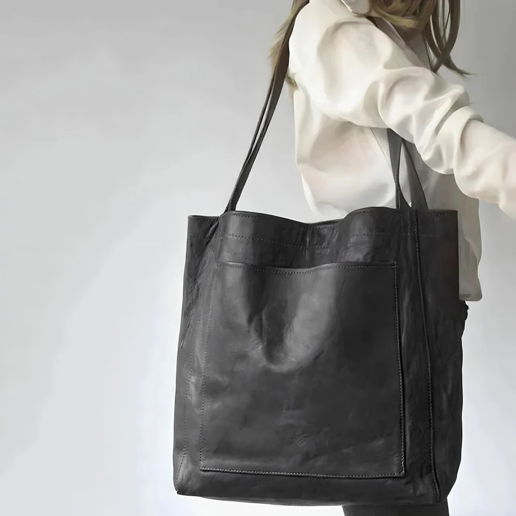 Belro women's leather bag with sleek design, showing smooth leather surface and elegant wallet-style accessory.