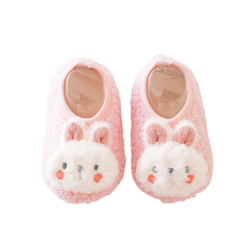 Belro baby sock shoes worn by a small child, featuring soft fabric and colorful patterns, perfect for comfortable little feet.