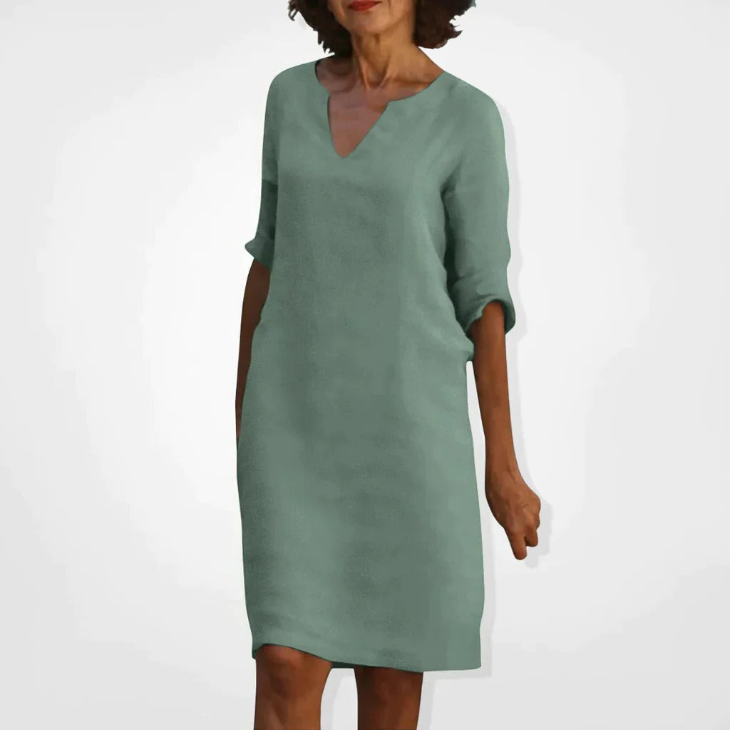 Belro summer dress with V-neck featuring lightweight fabric and a flowing silhouette, perfect for warm weather.