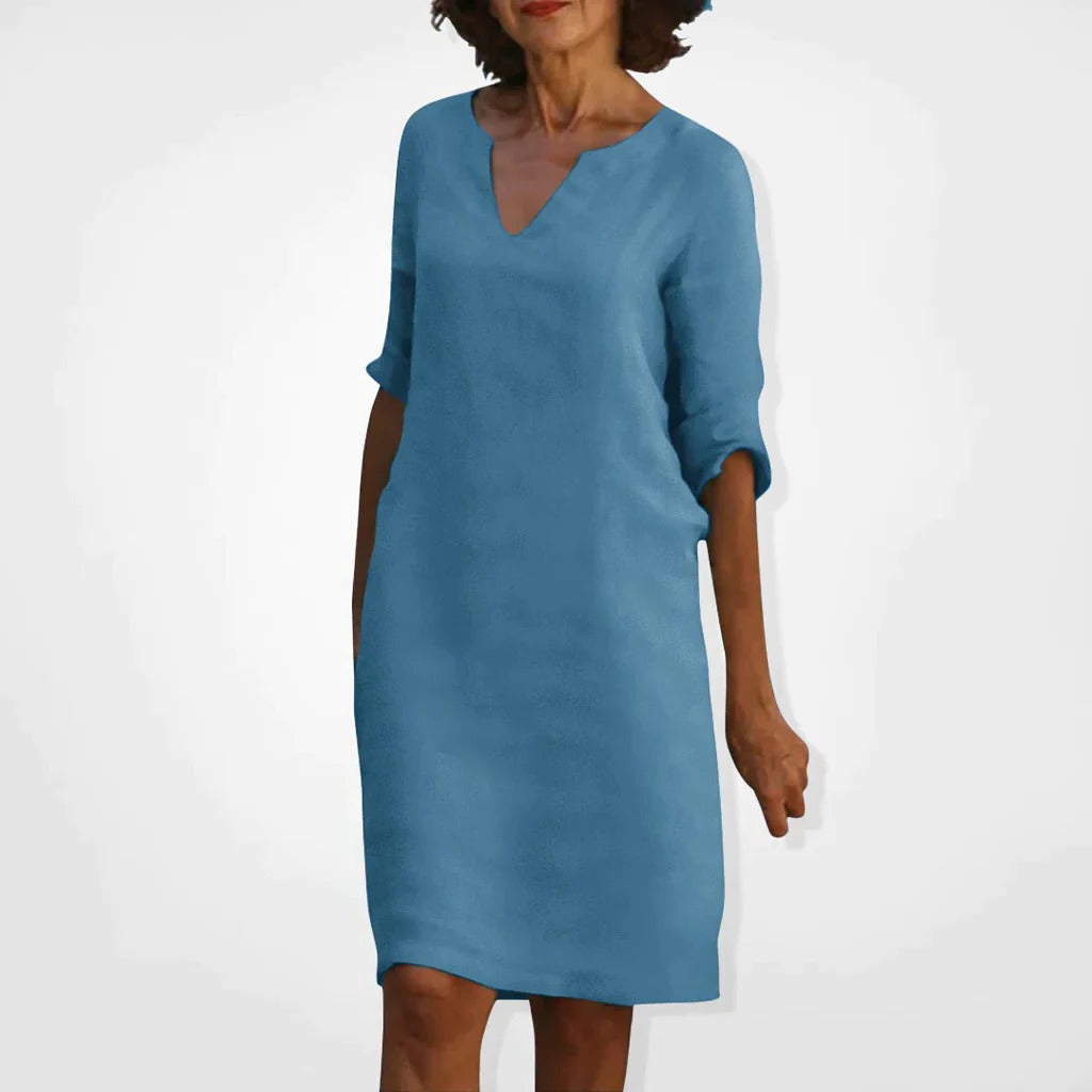 Belro summer dress with V-neck, lightweight fabric, sleeveless design, and floral pattern, perfect for warm weather.