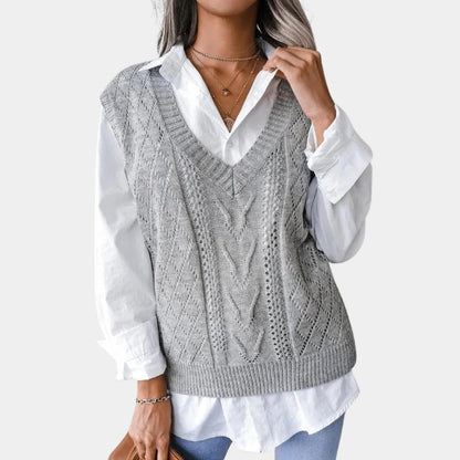 Women's V-neck knitted cardigan by Belro, styled with a cozy fit and detailed knit pattern in a soft, neutral color.