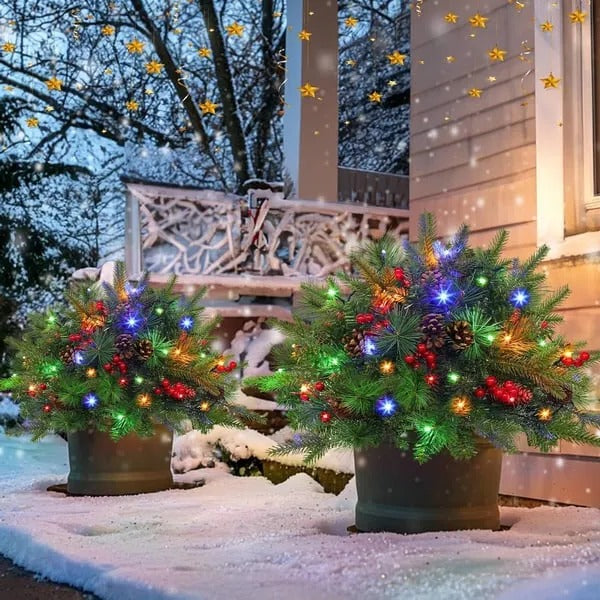 Belro pre-lit artificial Christmas tree with realistic pine branches in an urn-style planter, decorated for holiday decor.