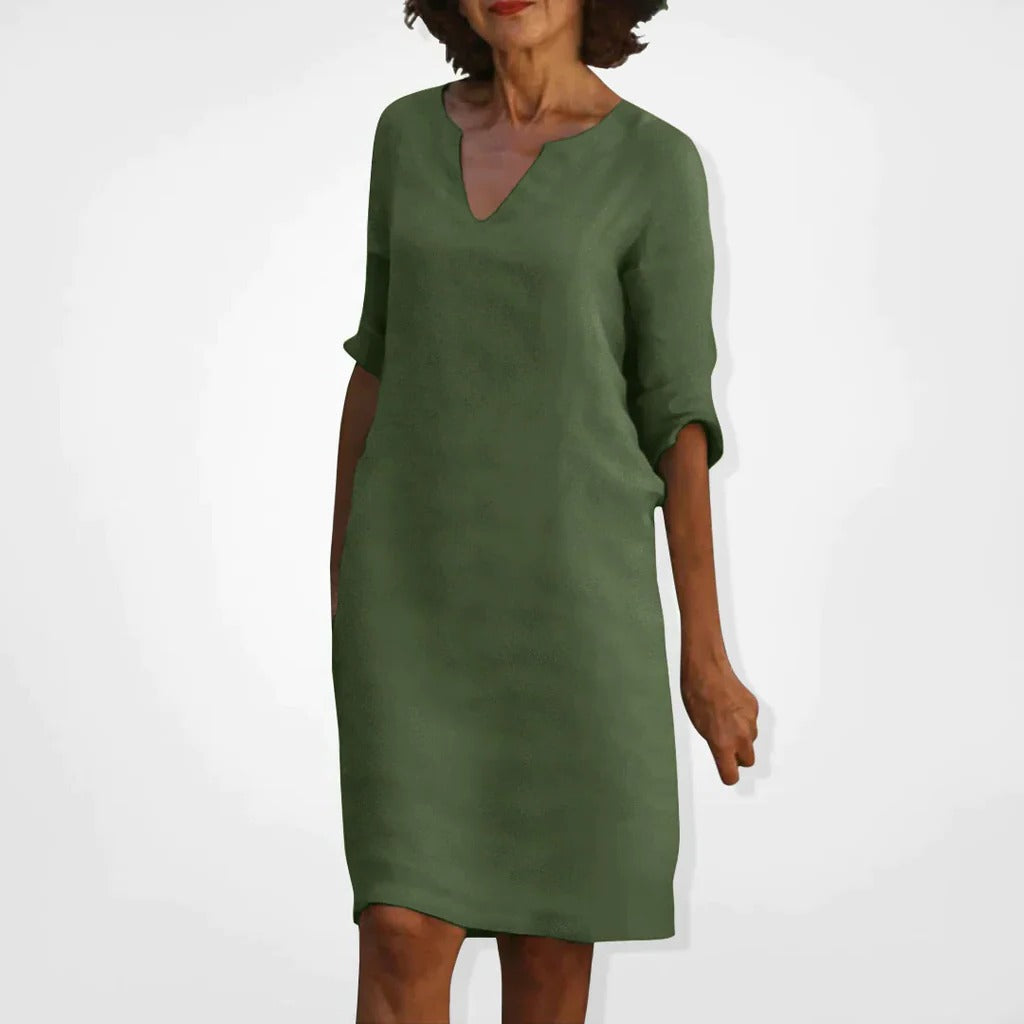 Belro summer dress with a V-neck, sleeveless design, lightweight fabric, and floral pattern for warm weather wear.