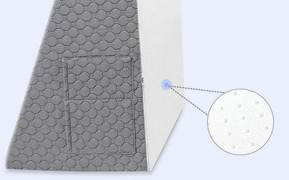 Belro Triangle Memory Foam Wedge Pillow for sleeping, showing its firm, supportive design and soft fabric cover in natural lighting.