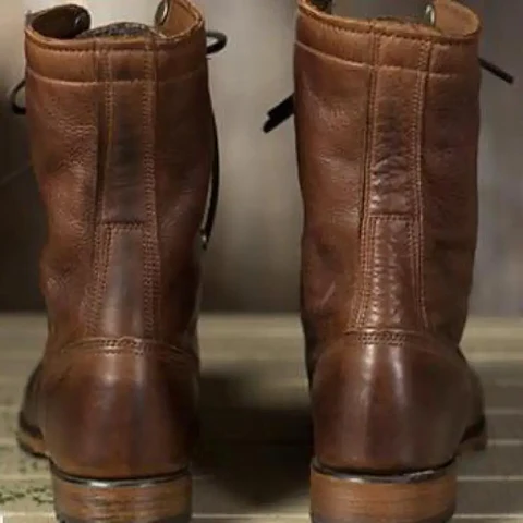 Belro women's boots with stylish ankle-high design, featuring leather material and decorative buckles.