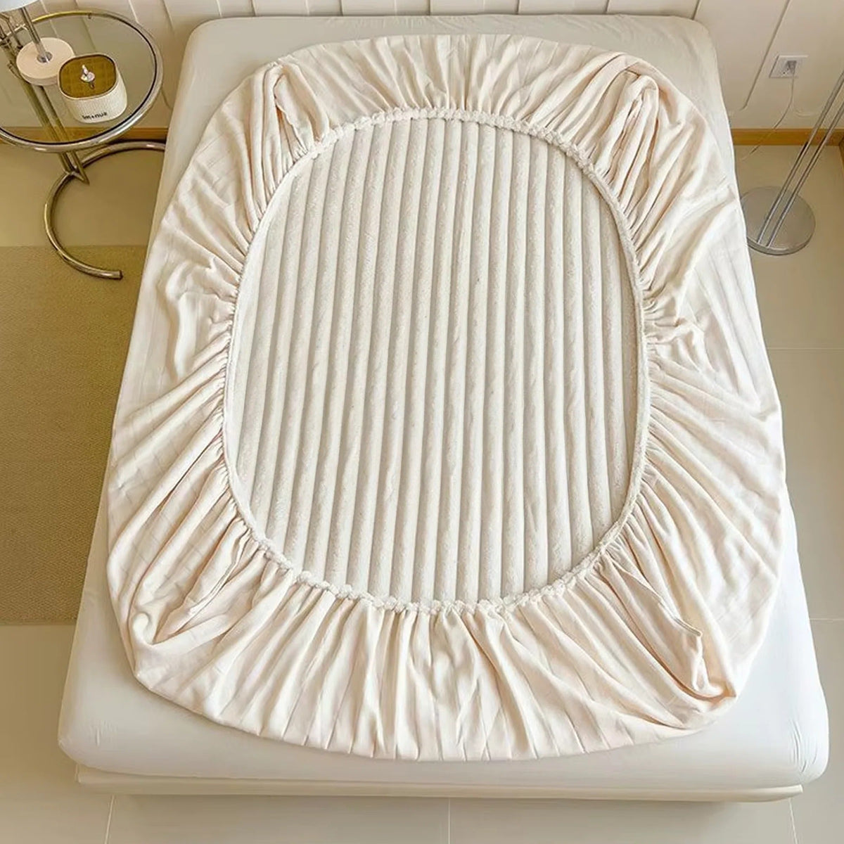 Belro ultra-soft luxury fitted bed sheet in a cozy, smooth fabric, neatly fitted on a bed with a soft, inviting appearance.