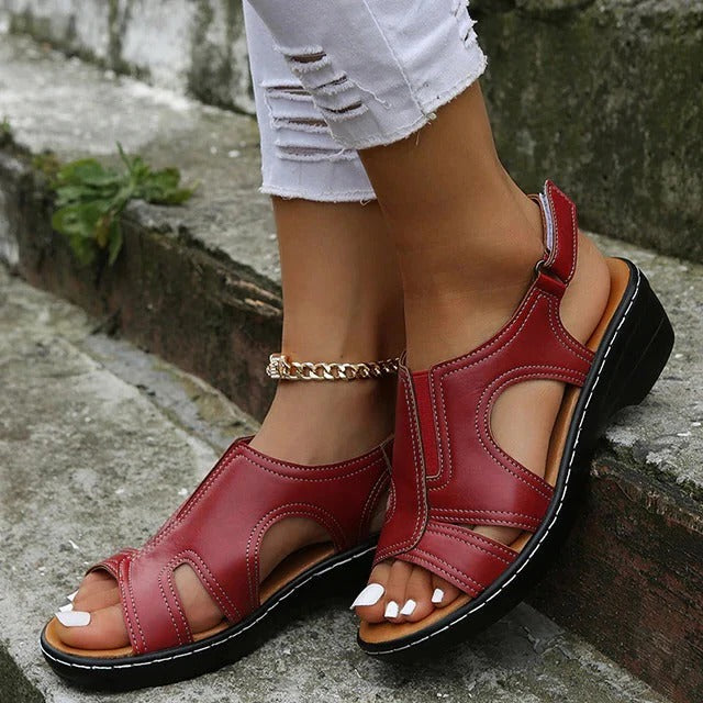 Belro premium leather wedge sandals for women, showcasing stylish design and comfortable heel height in a natural outdoor setting.