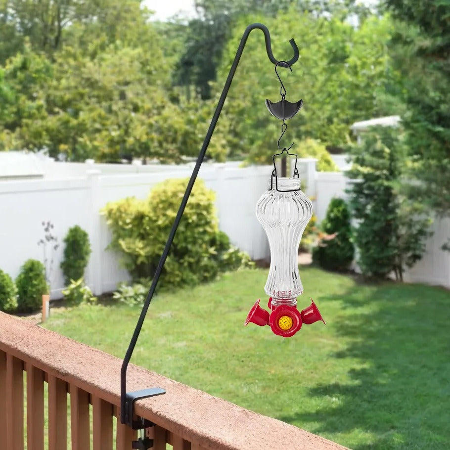 Decorative glass hummingbird feeder with flower design and ant moat by Belro for home and garden.